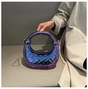 Close-up of gradient purple acrylic crescent bag with luxury quilted texture and gold chain