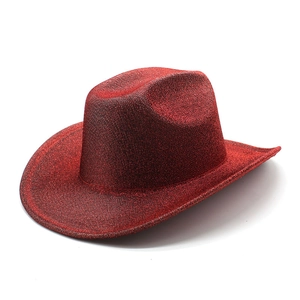 Macro shot of red glitter cowboy hat with wool felt texture for party decoration