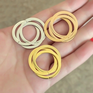 Mirror polished stainless steel triple interlocking rings in gold and silver finish