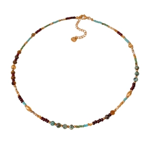 Boho chic titanium steel necklace with colorful beads and gold spacer beads on white background