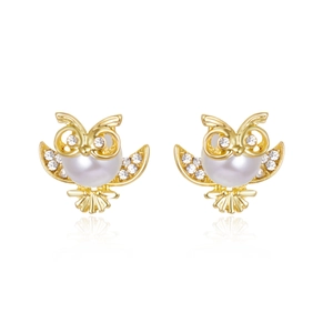 Golden owl stud earrings with artificial pearls and cubic zirconia on white background