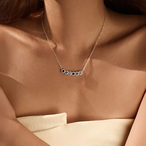 S925 sterling silver necklace with blue gradient gemstone pendant on female neck