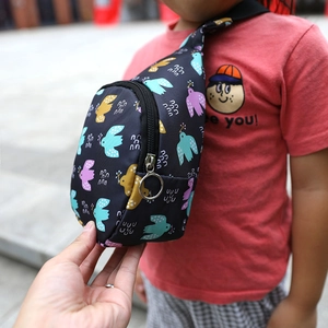 Close-up of kids nylon chest bag with colorful bird print and round zipper detail
