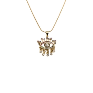 Elegant gold necklace with a colorful zircon evil eye pendant on a thin snake chain