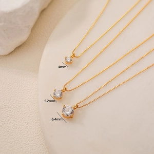 Detailed comparison of 4mm, 5.2mm, and 6.4mm gold zircon necklaces in a macro view