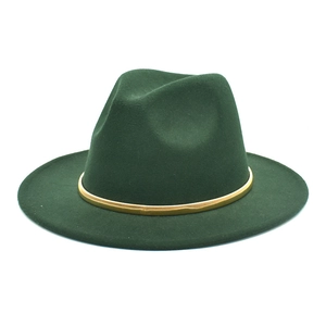 Detailed macro of dark green wool fedora with a decorative shiny gold metallic hat band