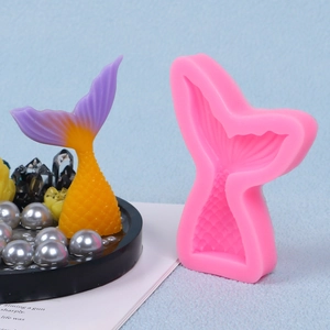 Detail view of pink silicone mermaid tail mold with a gradient color fish tail craft