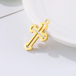 Polished golden stainless steel hollow cross pendant with top ring on white base