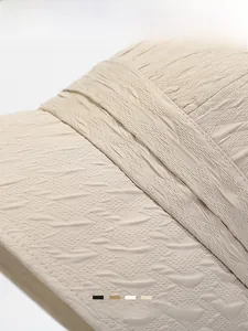 Close-up showing wave texture on a khaki bucket hat with multiple color options