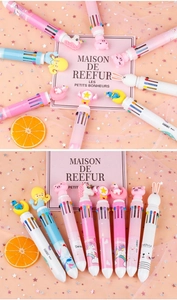 Macro detail of multi-colored cartoon pens with unicorn and rabbit character caps