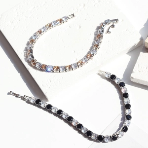 Macro view of 5mm tennis bracelets with cubic zirconia stones in silver setting