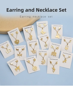 Detailed set of golden stainless steel butterfly and unicorn necklace with stud earrings