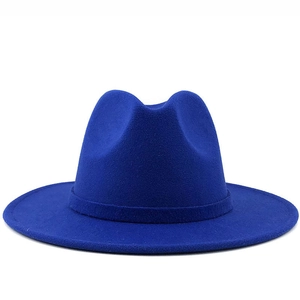 Detail showing the classic indented crown and matte wool texture of royal blue fedora hat