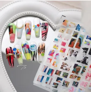 Close-up of abstract artistic nail stickers featuring portraits and leopard patterns
