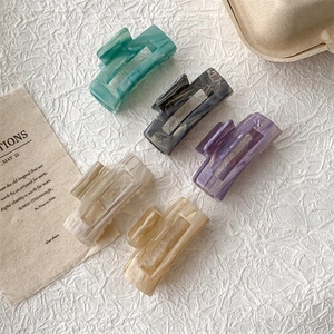 French vintage acetate hair claws with elegant marble patterns in multiple colors