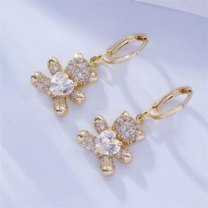 Detail of bear earrings with sparkling gold plating and heart-shaped cubic zirconia