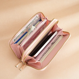 Pink minimalist long zip-around wallet for women with card slots and inner compartments