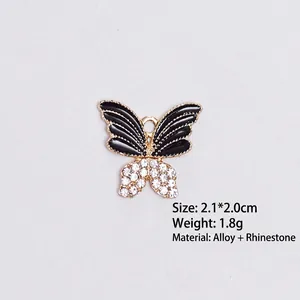 Detail of butterfly pendant with black oil drip wings and white rhinestones, size 2.1x2.0cm