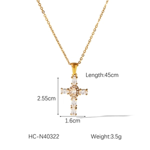 Detailed view of a gold-plated cross necklace with inlaid zircons and size specifications