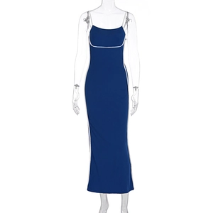 Detail of navy blue bodycon maxi dress with white piping and thin spaghetti straps