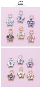 Macro shot of plum blossom zircon pendants in gold and silver for DIY jewelry making