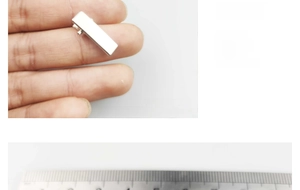 Detailed view of a 2cm silver rectangular metal hair clip base for DIY crafting