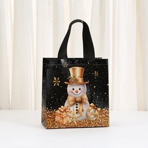 Black non-woven Christmas gift bag with golden snowman prints and durable handles