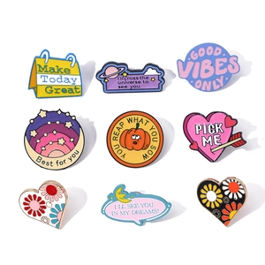 Set of 9 colorful enamel pins with inspirational quotes and creative cartoon designs