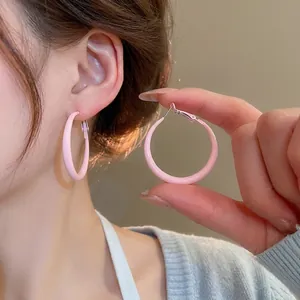 Pink matte round hoop earrings for women featuring a minimalist aesthetic and silver pin
