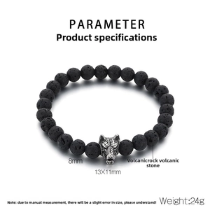 Detail view of 8mm lava rock bead bracelet with a silver wolf head charm on white background