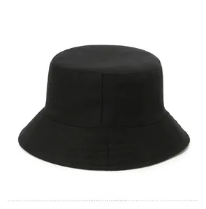 Flat lay detail showing the back view of a minimalist black cotton bucket hat
