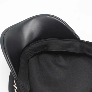 Detailed view of the black wool cap interior with leather brim and metallic chain accents
