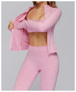Detailed texture of pink heathered fabric on long-sleeved sports jacket with thumbholes