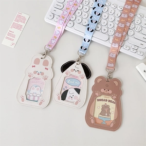 Close-up of cute cartoon PU leather card holders with animal designs and matching lanyards