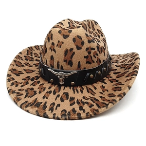 Detail of leopard print cowboy hat with black leather band and metal bull head buckle