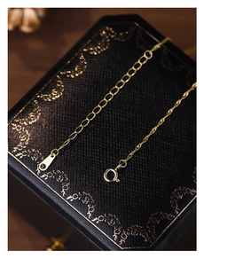 Detail view of 18K gold S925 sterling silver water wave chain with S925 hallmark