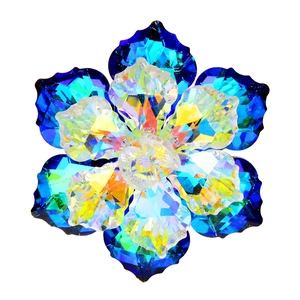 Macro shot of faceted crystal flower brooch with sapphire blue and AB gradient petals