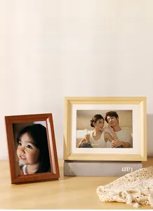 Close-up of premium wooden picture frames with wide borders and elegant white matting