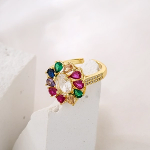 Luxe gold plated adjustable ring with colorful zircons and large oval crystal centerpiece