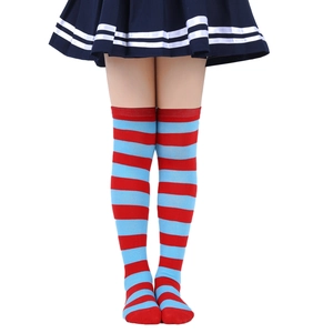 Detail view of red and blue striped over-the-knee socks made of knitted fabric