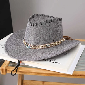 Detail of grey sun hat with ethnic beaded band, metal eyelets, and adjustable chin strap
