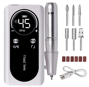 Complete electric nail drill kit with white controller, silver handpiece, and drill bits