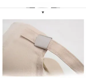 Detail view of adjustable metal buckle and twill fabric strap on a beige baseball cap