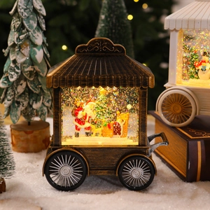 Macro detail of a vintage bronze Christmas snow globe lamp featuring Santa and warm LED lights