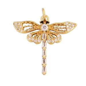 Macro detail of dragonfly pendant with zircon inlay and golden wings finish