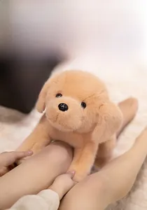 Close-up of fluffy golden retriever plush toy with soft faux fur in a cozy home setting