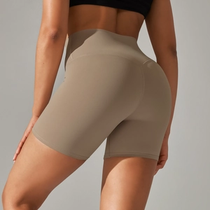Close-up of high-waisted yoga shorts with V-shaped back seam and booty lifting effect