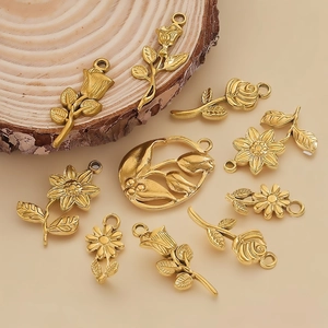 Vintage matte gold rose and sunflower pendants on wood slices for DIY jewelry