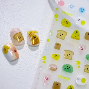 3D embossed bear and snack nail stickers with cute food patterns on white textured base