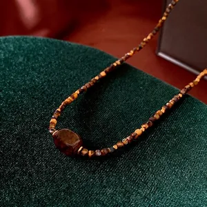 Maillard faux tiger eye beaded necklace with brown rectangle gemstone and retro design